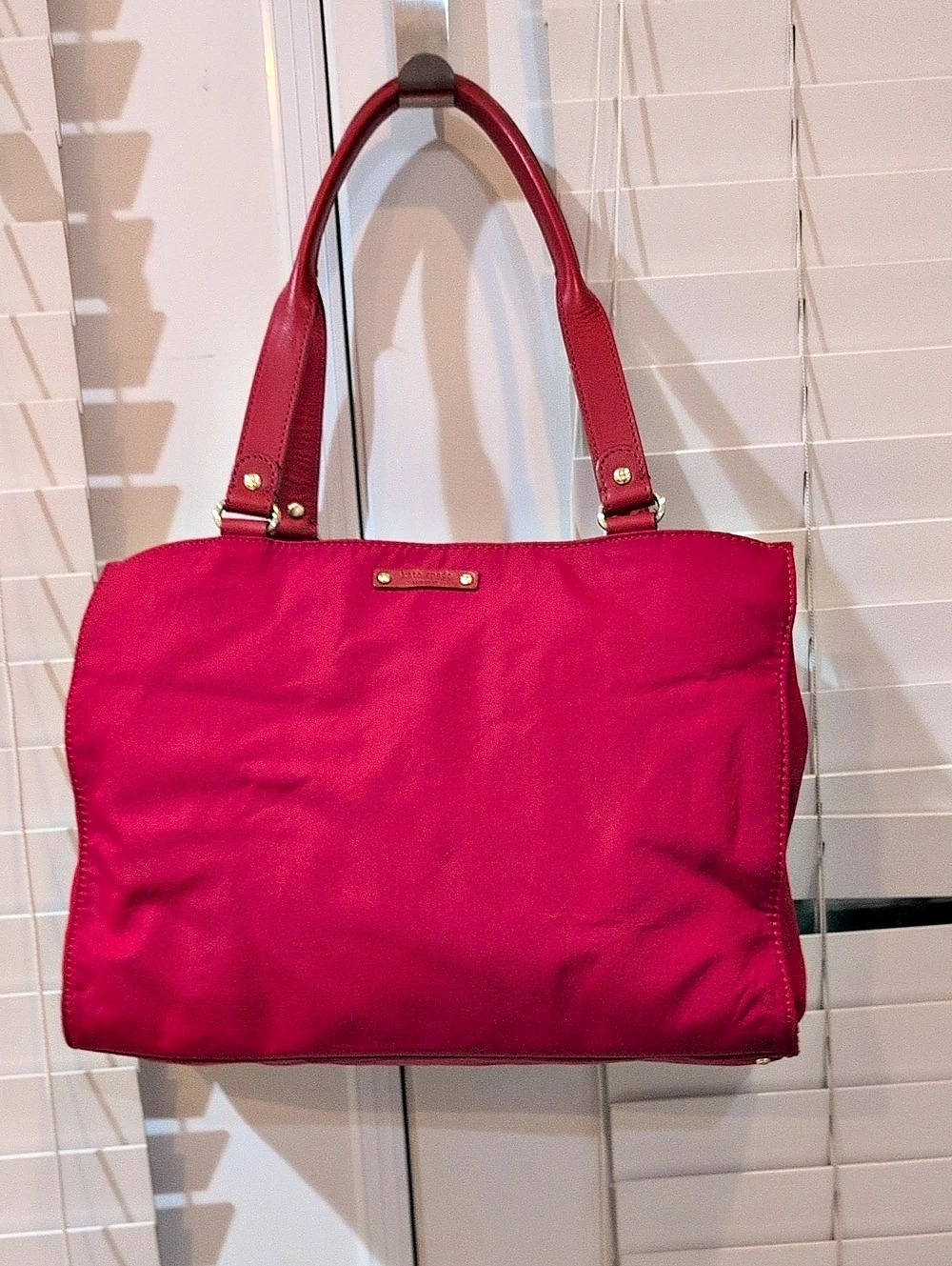 Kate Spade Dawn Medium Nylon Satchel Tote in a red nylon finish.